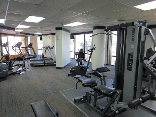 1096 Scenic Gulf Dr Ph 1610, Miramar Beach, FL 32550 - exercise room featuring carpet floors and a paneled ceiling