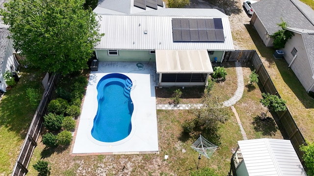 view of subject property with a pool area