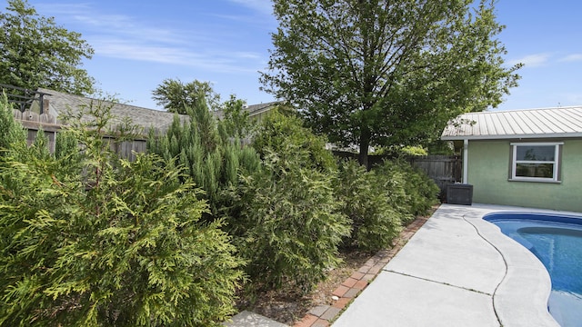 view of pool with a fenced backyard