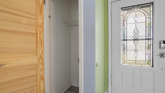 interior space featuring baseboards