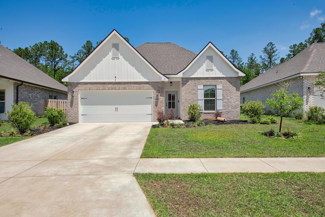 view of front of home with board and batten siding, brick siding, a garage, a front lawn, and driveway