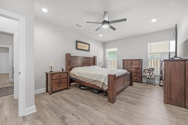 bedroom with light wood-type flooring, baseboards, ceiling fan, and recessed lighting