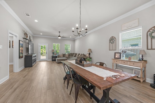 dining room with a chandelier, light wood-style flooring, recessed lighting, baseboards, and crown molding