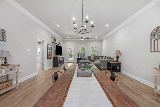 dining area with recessed lighting, light wood-style flooring, baseboards, a chandelier, and crown molding