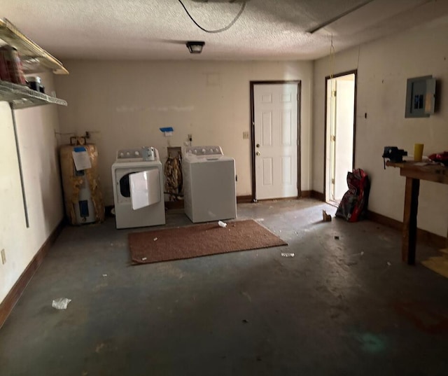 laundry room featuring independent washer and dryer, electric panel, electric water heater, baseboards, and a textured ceiling