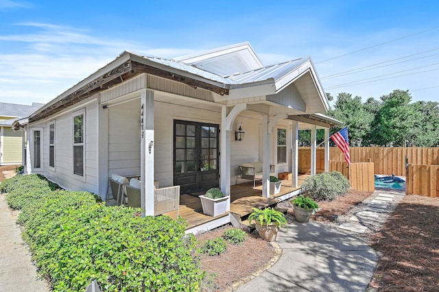 4485 Luke Ave Unit B, Destin, FL 32541 - view of front of property featuring fence and metal roof