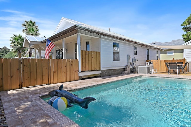 4485 Luke Ave Unit B, Destin, FL 32541 - view of pool with central air condition unit, fence, and a patio