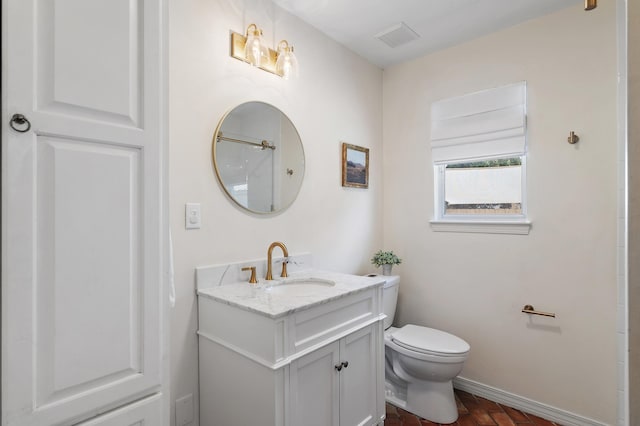 4485 Luke Ave Unit B, Destin, FL 32541 - bathroom with toilet, baseboards, and vanity