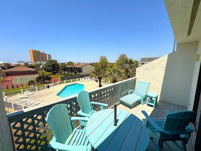 balcony featuring view of pool area