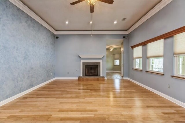 84 12th St, Shalimar, FL 32579 - unfurnished living room featuring a ceiling fan, light wood-style floors, a high end fireplace, ornamental molding, and baseboards