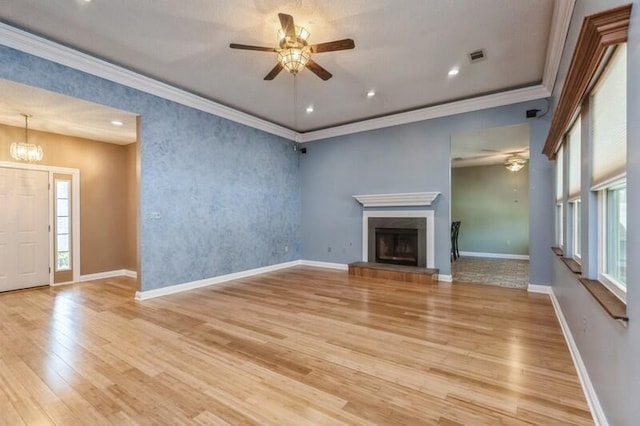 84 12th St, Shalimar, FL 32579 - unfurnished living room with a ceiling fan, light wood-type flooring, ornamental molding, a chandelier, and baseboards