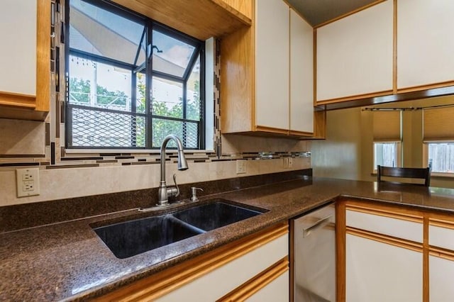 84 12th St, Shalimar, FL 32579 - kitchen with a sink, white cabinets, stainless steel dishwasher, tasteful backsplash, and plenty of natural light