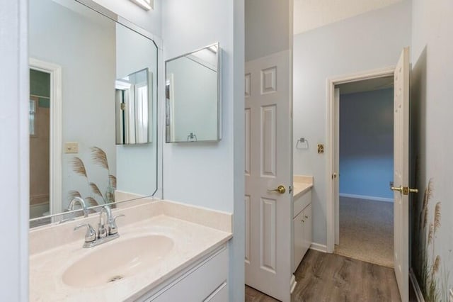 84 12th St, Shalimar, FL 32579 - bathroom with vanity and wood finished floors