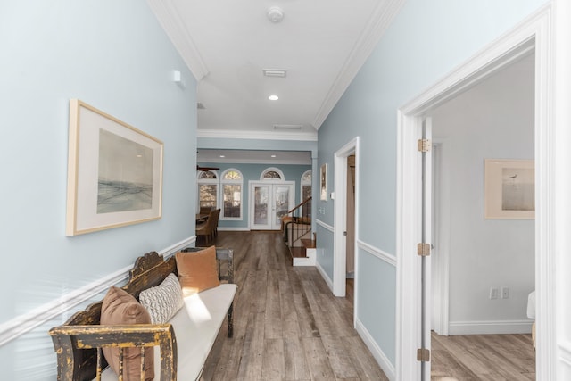 hallway featuring ornamental molding, wood finished floors, recessed lighting, and baseboards