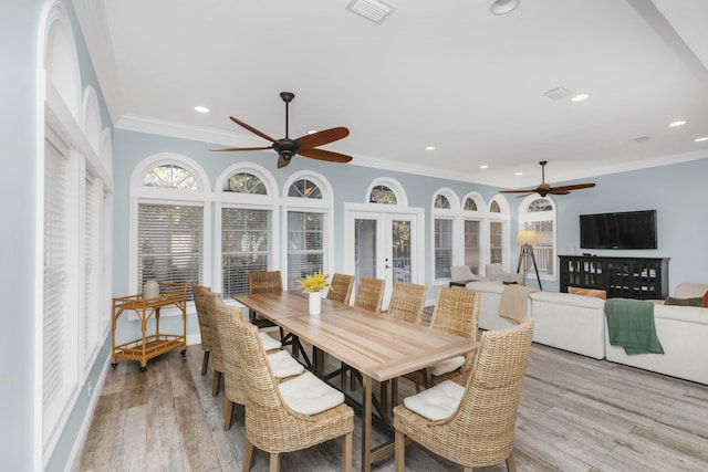 sunroom / solarium featuring french doors