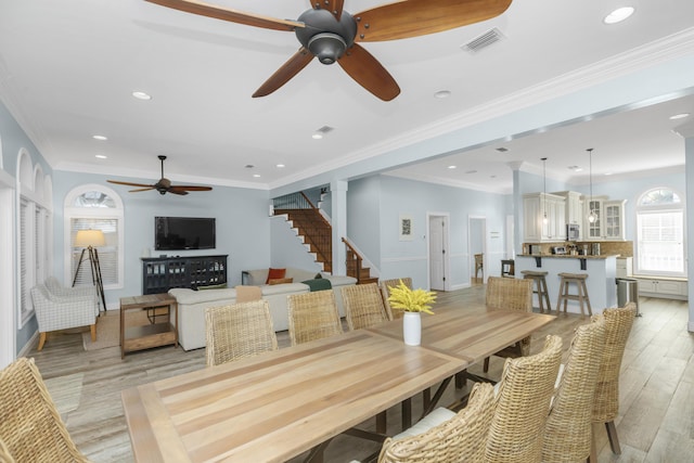 dining space featuring ceiling fan, light wood-style flooring, stairs, recessed lighting, and baseboards