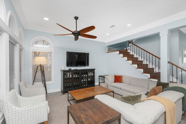 living room with a ceiling fan, ornamental molding, stairway, wood finished floors, and baseboards