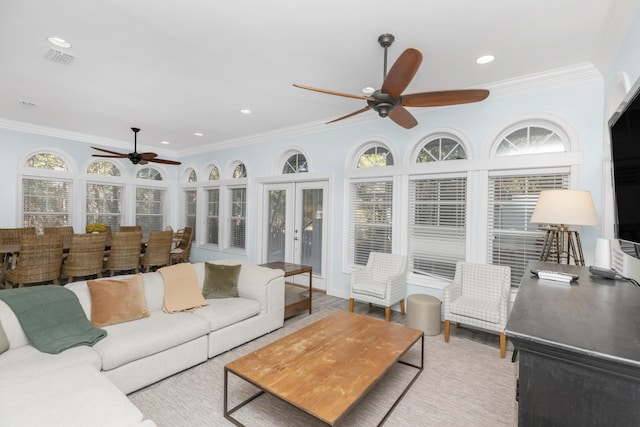 living room featuring ceiling fan, french doors, ornamental molding, and recessed lighting