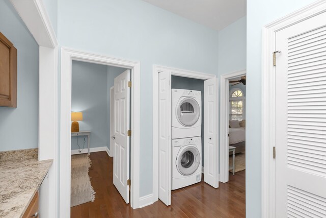 55 The Greenway Loop, Inlet Beach, FL 32461 - laundry area featuring stacked washing machine and dryer, dark wood-type flooring, baseboards, and a ceiling fan