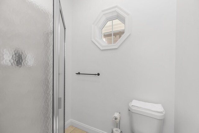 55 The Greenway Loop, Inlet Beach, FL 32461 - bathroom with toilet, baseboards, tile patterned flooring, and a stall shower