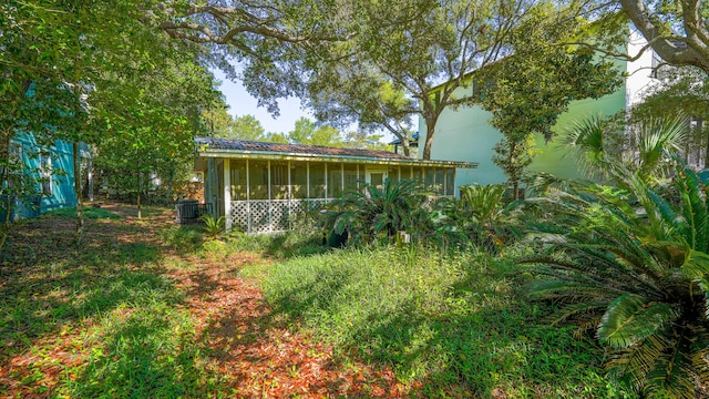 view of yard with a sunroom