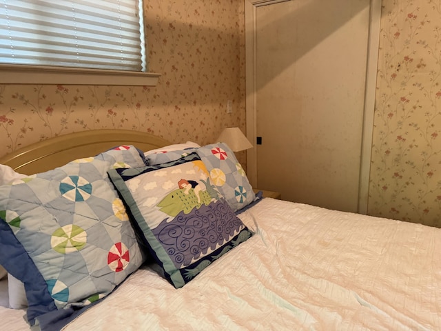 bedroom featuring wallpapered walls