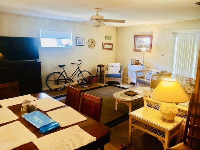 living area featuring a ceiling fan