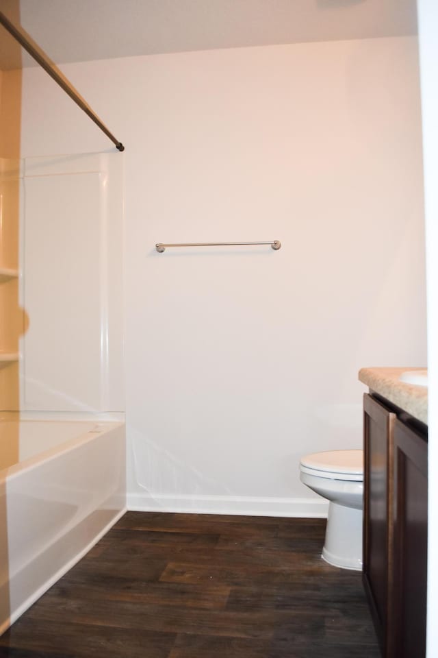 575 Earl Godwin Rd, Freeport, FL 32439 - full bathroom with wood finished floors, toilet, baseboards, and vanity