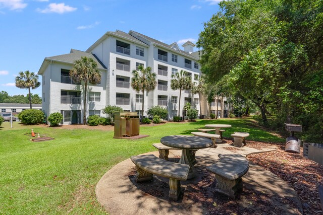 4274 Calinda Ln Unit 215, Niceville, FL 32578 - view of property's community featuring a lawn