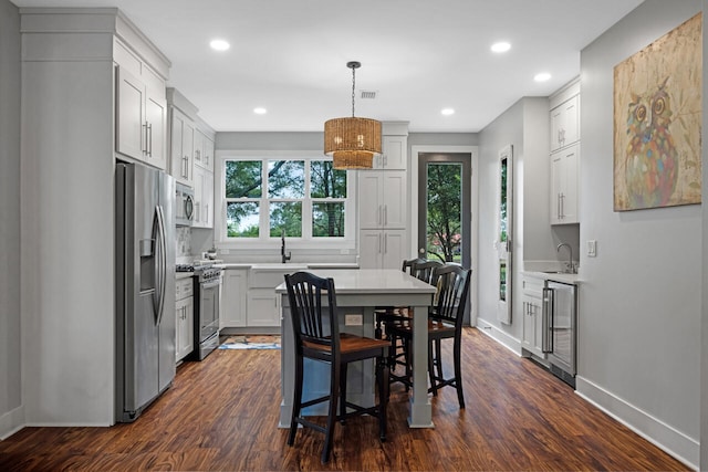 1650 Caswell Rd, Defuniak Springs, FL 32433 - dining room with beverage cooler, baseboards, dark wood-style floors, and recessed lighting