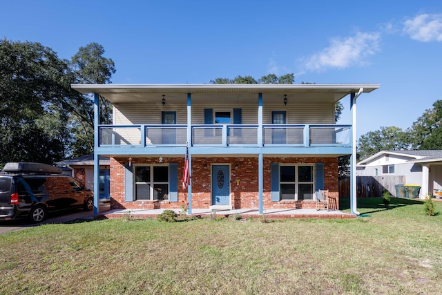 327 NE Yacht Club Dr, Fort Walton Beach, FL 32548 - view of front of property with a balcony, a porch, and brick siding