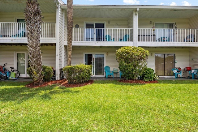 2000 Scenic Gulf Dr Unit 3, Miramar Beach, FL 32550 - back of house featuring a balcony and a lawn