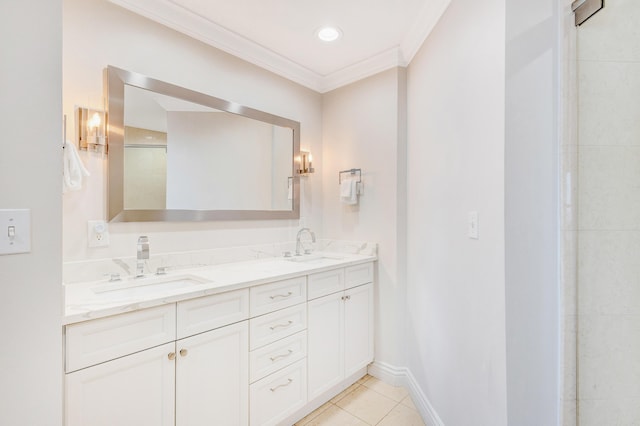 bathroom with crown molding, double vanity, tile patterned flooring, and baseboards