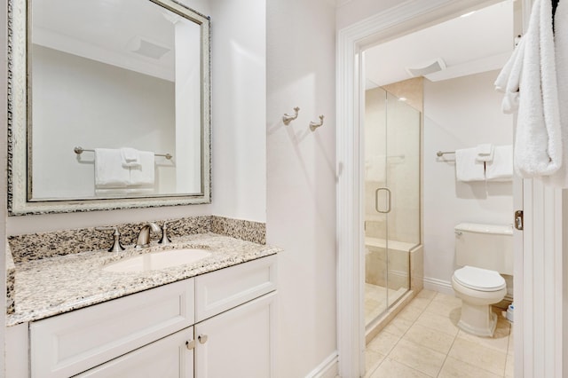 full bathroom featuring toilet, a shower stall, vanity, baseboards, and tile patterned flooring