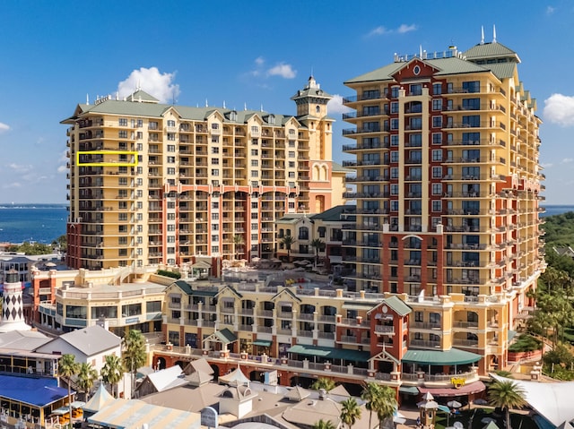 view of apartment building / complex featuring a water view