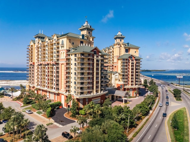 view of apartment building / complex with a water view