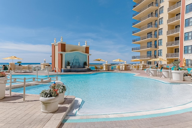 community pool featuring a patio area