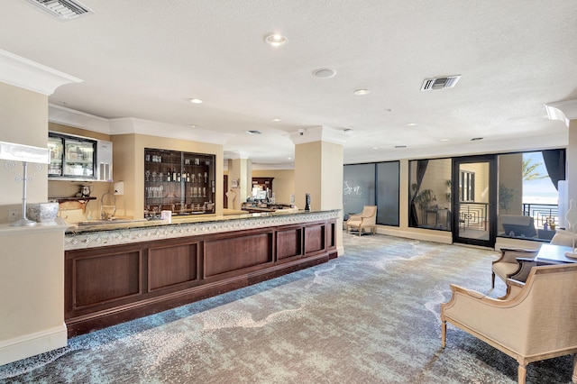 reception area featuring crown molding and recessed lighting
