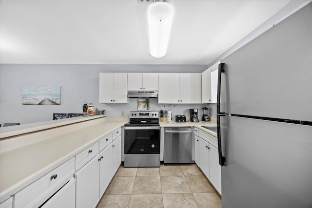25 Misty Cv Unit 118, Miramar Beach, FL 32550 - kitchen featuring stainless steel appliances, under cabinet range hood, white cabinets, and light countertops