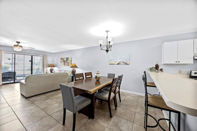 25 Misty Cv Unit 118, Miramar Beach, FL 32550 - dining space with a chandelier, light tile patterned flooring, and a ceiling fan