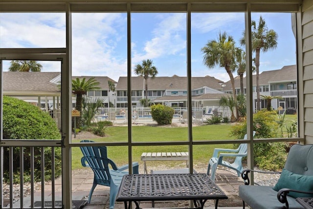 25 Misty Cv Unit 118, Miramar Beach, FL 32550 - sunroom with a residential view, healthy amount of natural light, and outdoor dining space