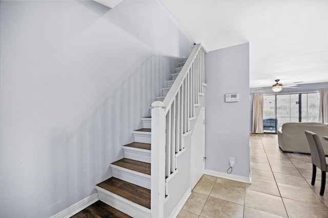 25 Misty Cv Unit 118, Miramar Beach, FL 32550 - stairway with baseboards, a ceiling fan, and tile patterned flooring