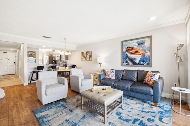 520 N Richard Jackson Blvd Unit 1510, Panama City Beach, FL 32407 - living area with ornamental molding, a chandelier, wood finished floors, baseboards, and recessed lighting