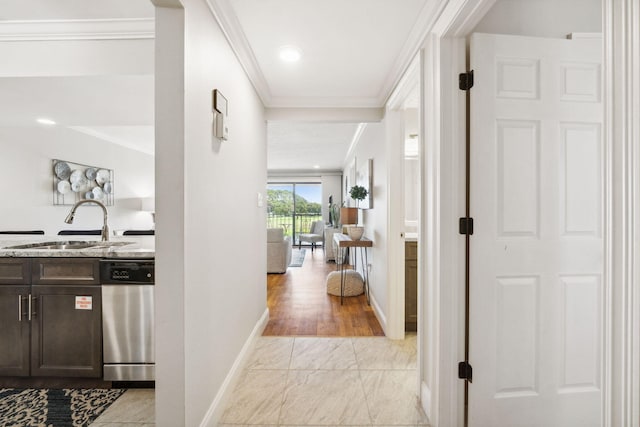 520 N Richard Jackson Blvd Unit 1510, Panama City Beach, FL 32407 - hall with a sink, ornamental molding, light marble finish flooring, and baseboards
