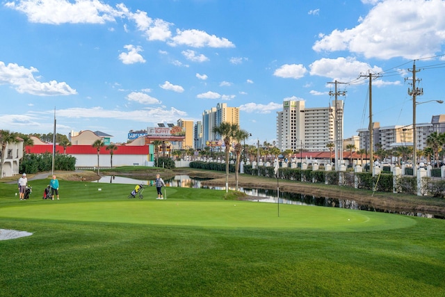 520 N Richard Jackson Blvd Unit 1510, Panama City Beach, FL 32407 - view of property's community with golf course view, a water view, and a lawn