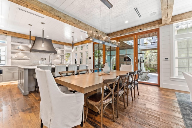 dining space with beamed ceiling, wood-type flooring, recessed lighting, and wooden ceiling
