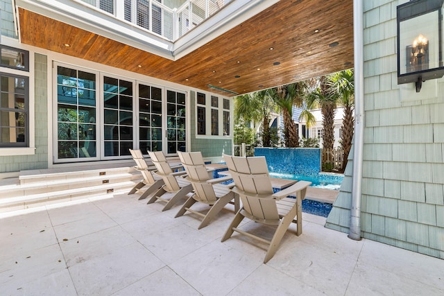 view of patio / terrace with an outdoor pool