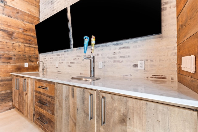 indoor wet bar with wood walls