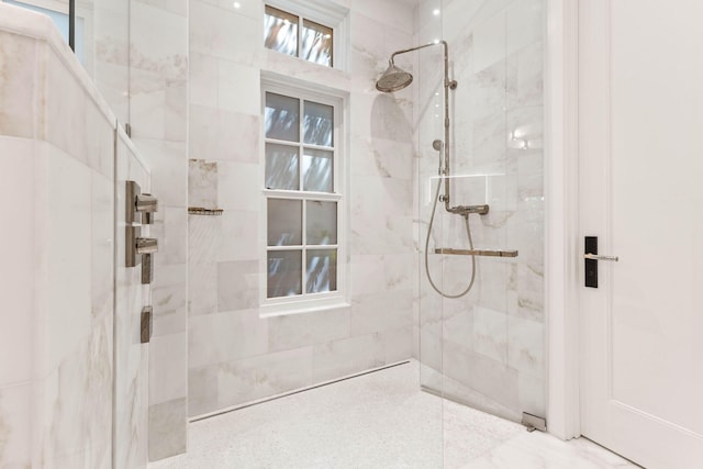 full bath with a tile shower