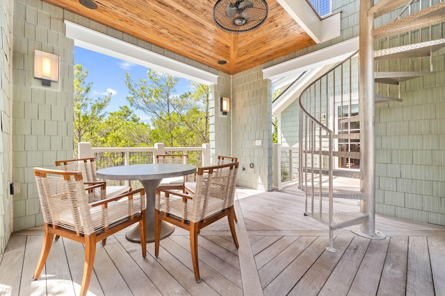 sunroom / solarium featuring vaulted ceiling